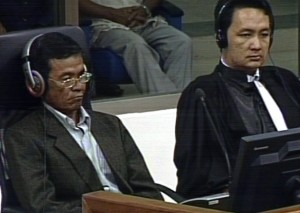 Witness Chhaom Se, accompanied by duty counsel, Lim Bunheng,  testifies before the Trial Chamber at the ECCC on Friday.